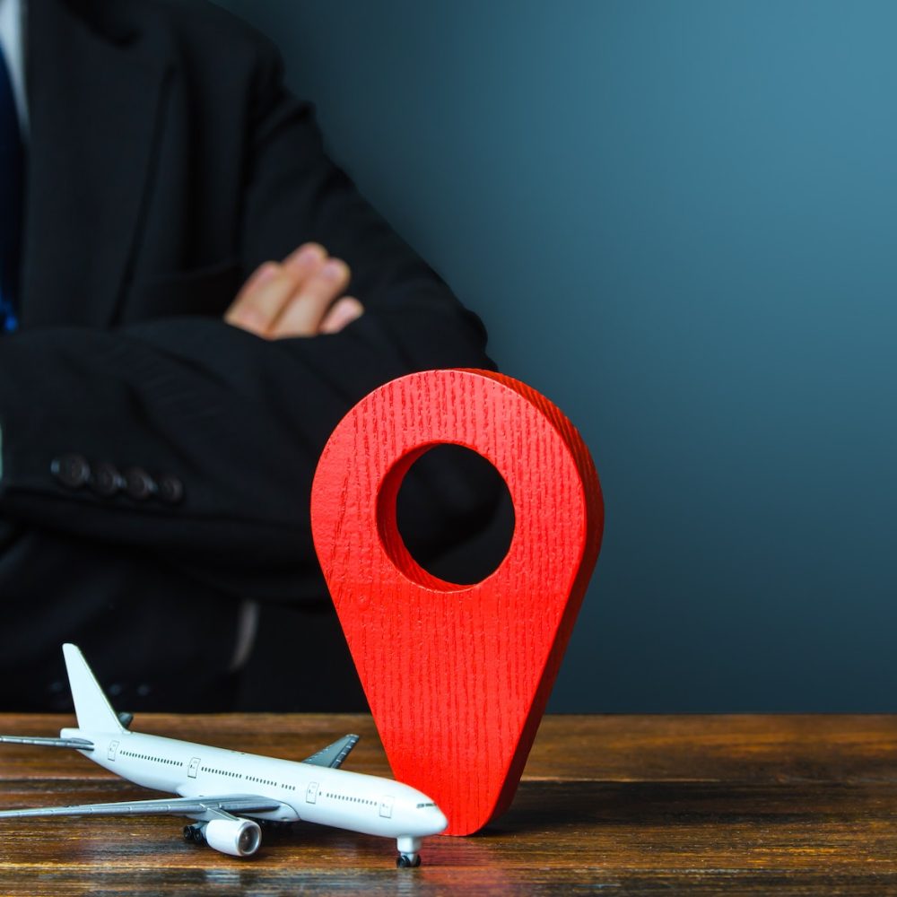 passenger plane and red location pin map icon.
